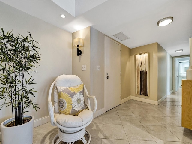 living area with light tile flooring