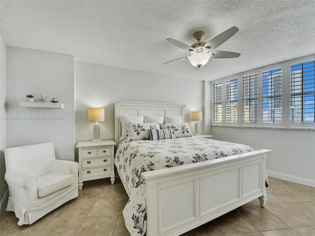 bedroom with light tile flooring, ceiling fan, and a textured ceiling