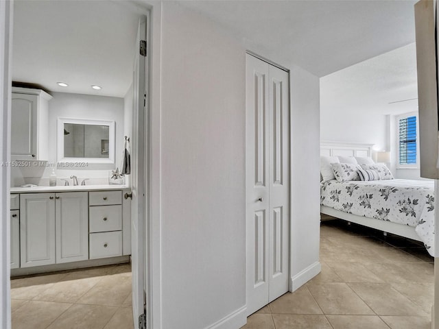 interior space with tile floors and large vanity