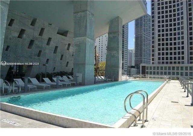 view of pool featuring a patio area