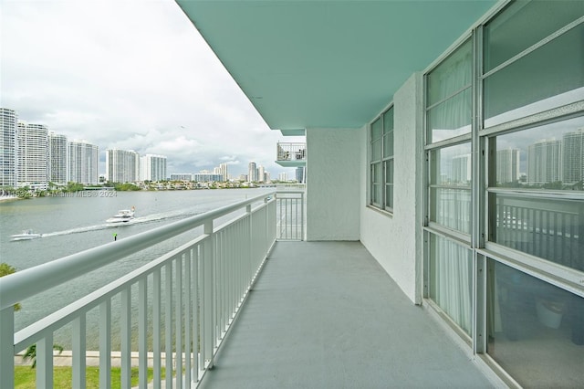 balcony featuring a water view