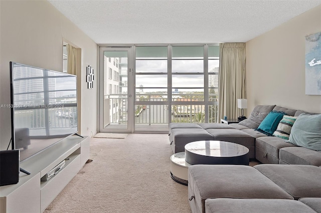 carpeted living room featuring expansive windows and a textured ceiling