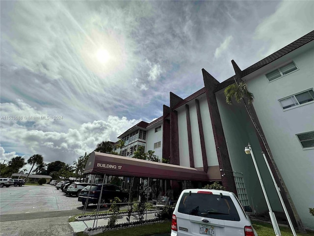 view of property featuring uncovered parking