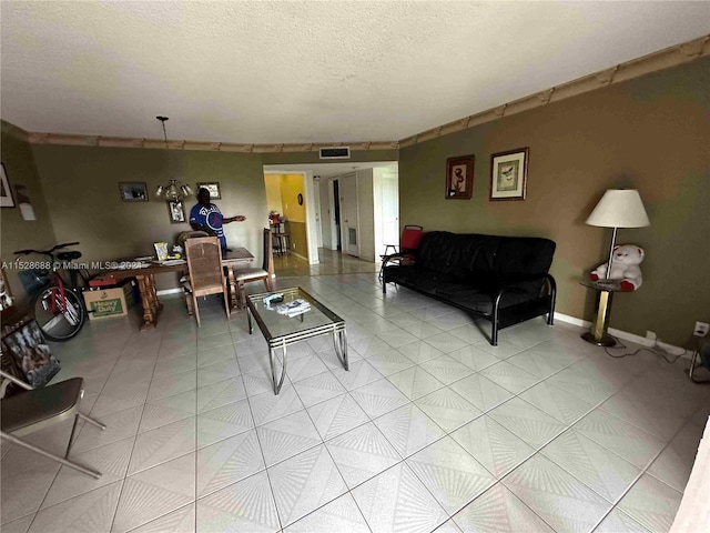 living area with visible vents and a textured ceiling