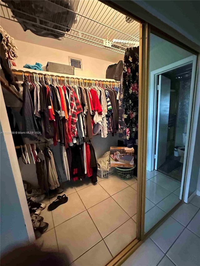 spacious closet with tile patterned flooring