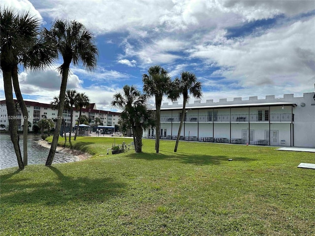 view of home's community with a lawn