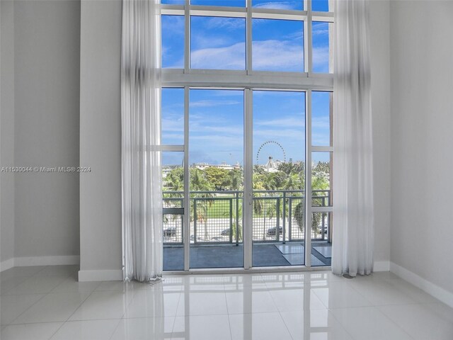 spare room featuring light tile flooring