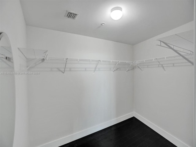 spacious closet featuring hardwood / wood-style floors