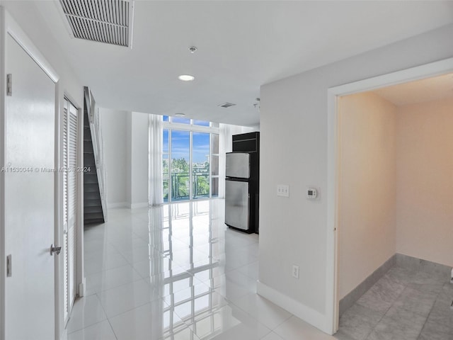 corridor with light tile flooring