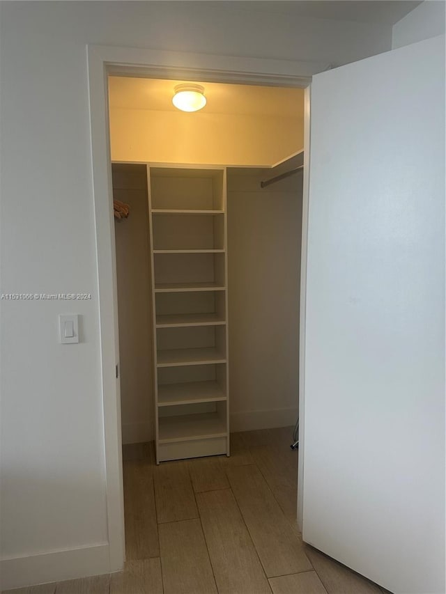 spacious closet featuring light wood-type flooring