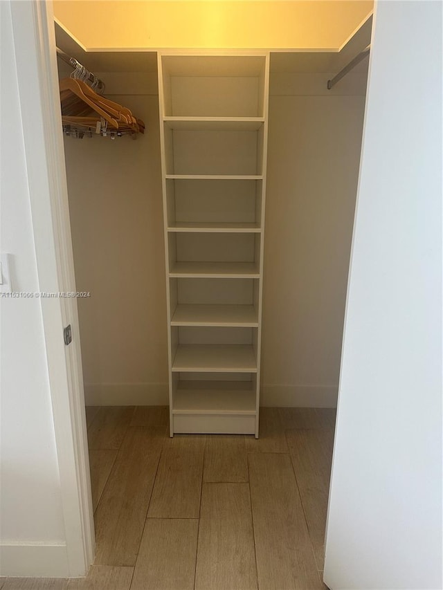 walk in closet featuring light hardwood / wood-style floors