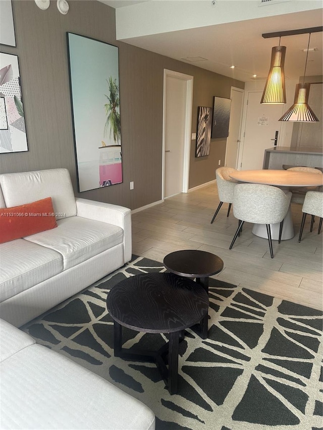 living room with light hardwood / wood-style flooring