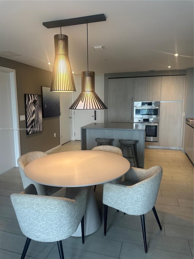 dining room with light wood-type flooring