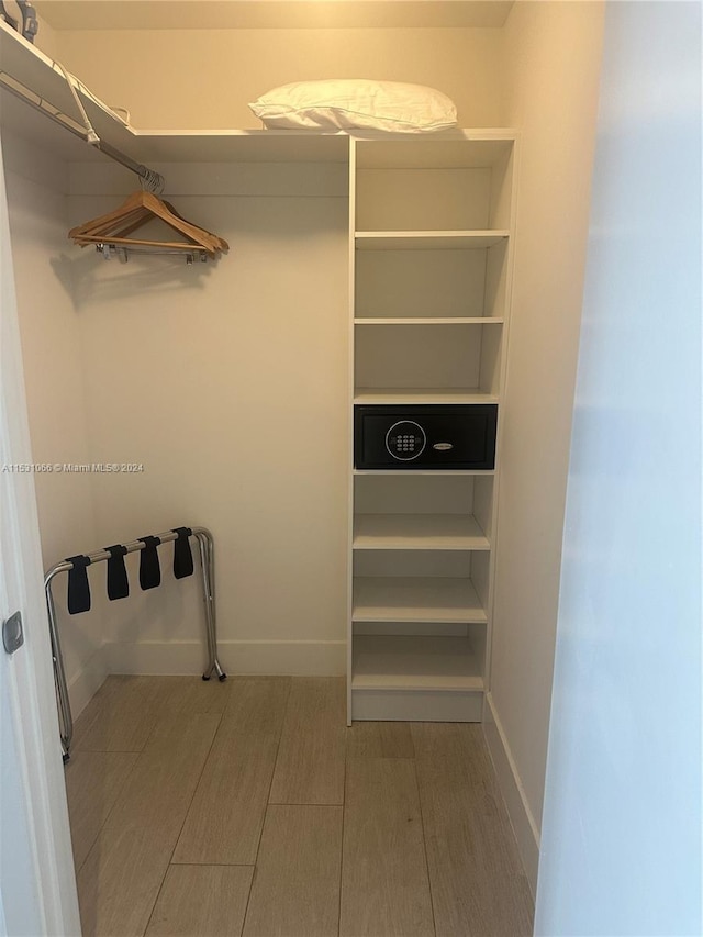 spacious closet with light wood-type flooring