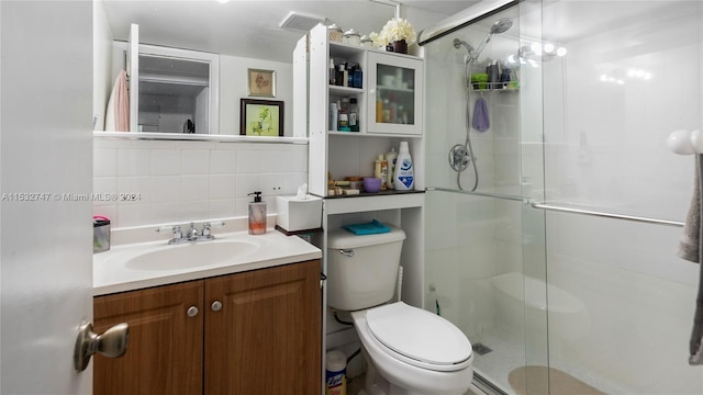 bathroom with walk in shower, toilet, tile walls, vanity, and decorative backsplash