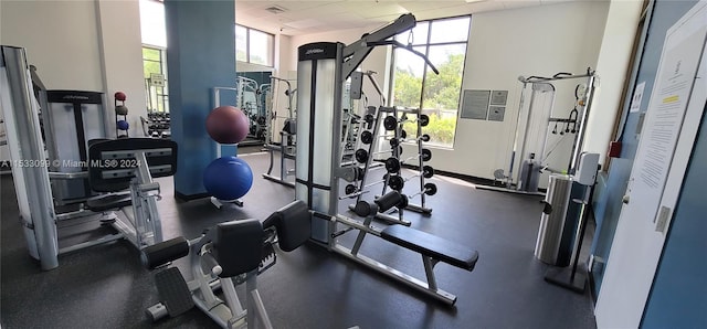 workout area featuring a drop ceiling