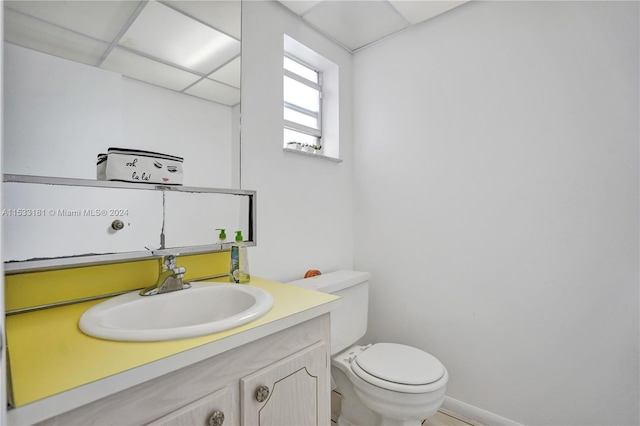 bathroom with toilet and vanity