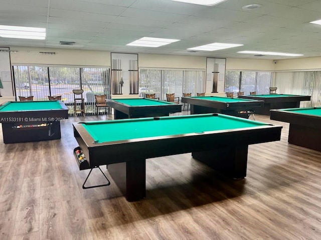 recreation room with a drop ceiling, billiards, and wood-type flooring