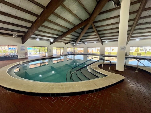 view of swimming pool featuring an indoor hot tub