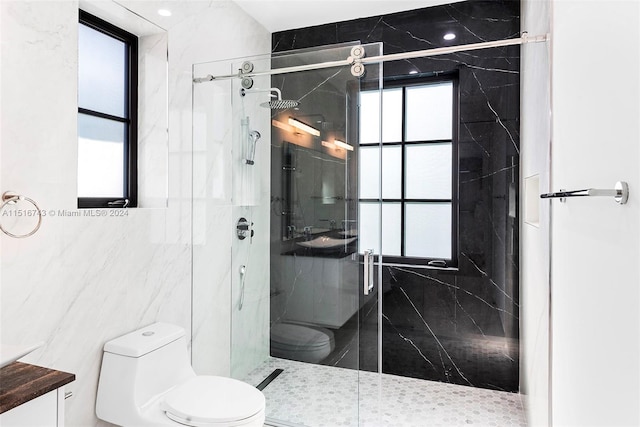 bathroom with vanity, toilet, walk in shower, and tile walls