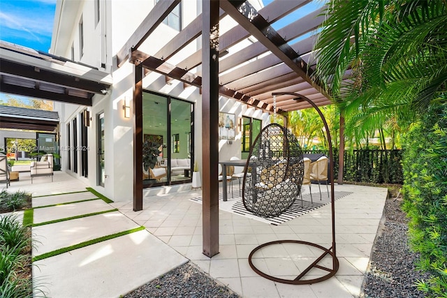 view of patio featuring french doors and a pergola