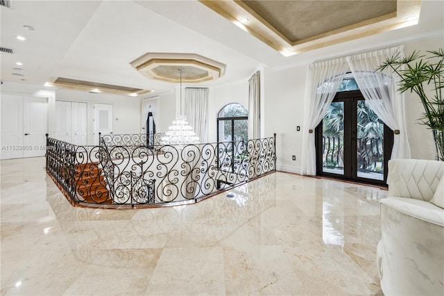 interior space featuring a notable chandelier and french doors