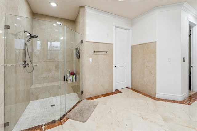 bathroom featuring a shower with door, tile flooring, and ornamental molding