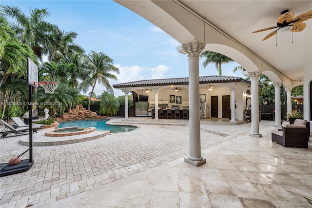 view of patio with a pool with hot tub, outdoor lounge area, and ceiling fan