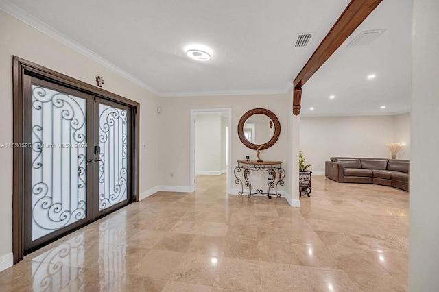 entrance foyer with french doors and ornamental molding