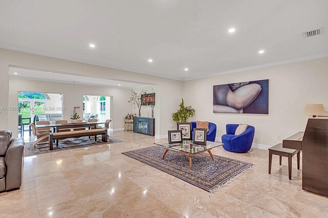 living room with crown molding and french doors