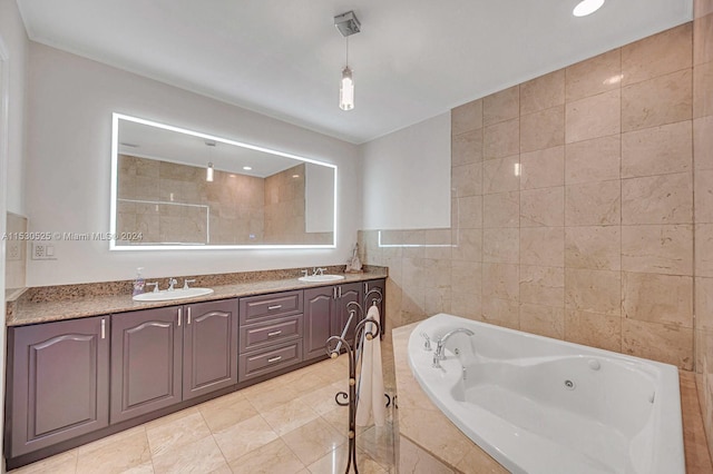 bathroom featuring tile patterned flooring, vanity, shower with separate bathtub, and tile walls