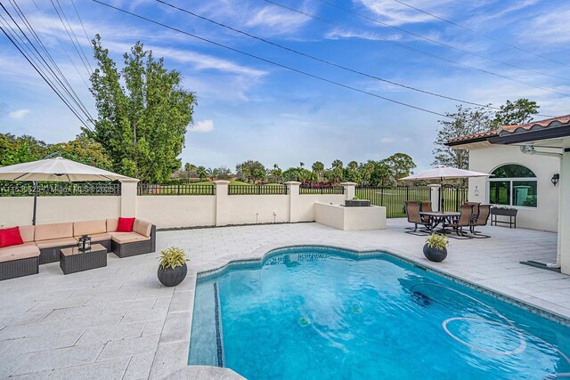 view of pool featuring an outdoor hangout area and a patio area