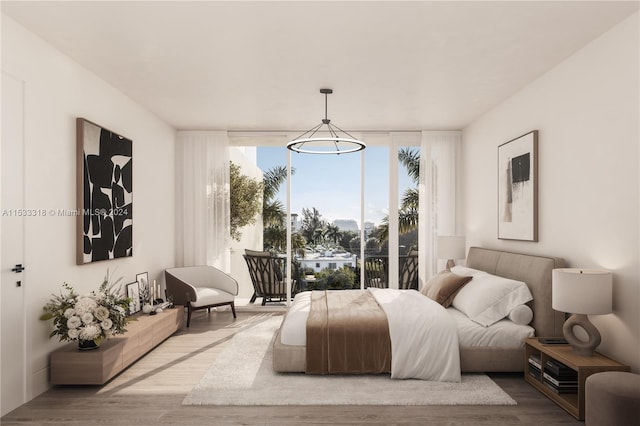 bedroom featuring access to outside, wood-type flooring, and a wall of windows