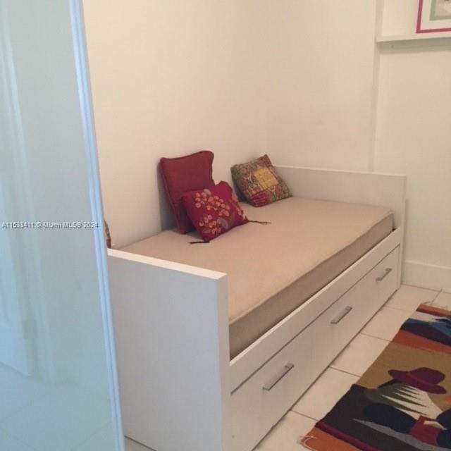 bedroom featuring light tile flooring