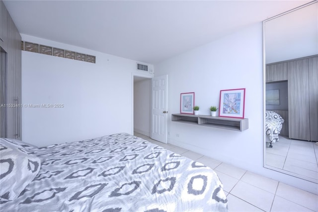 tiled bedroom with visible vents