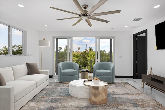 living room featuring ceiling fan and tile flooring