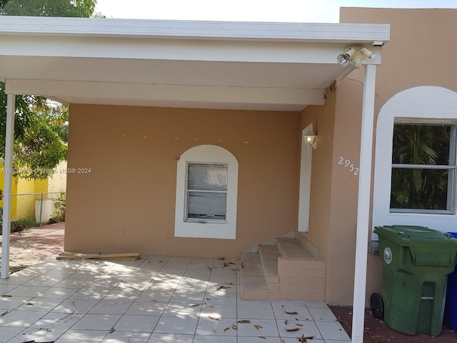 doorway to property with a patio area