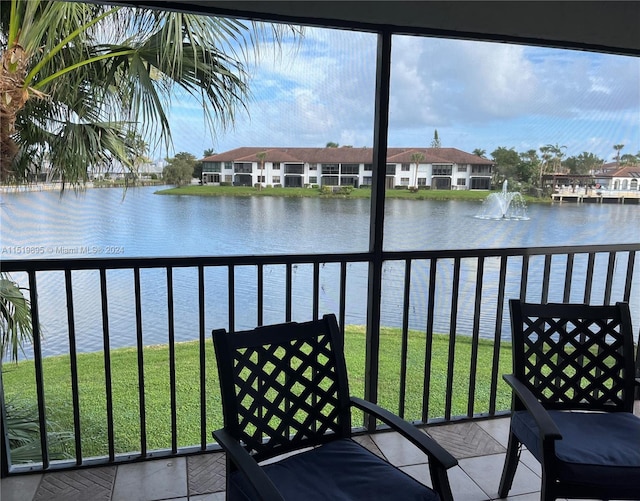 balcony featuring a water view