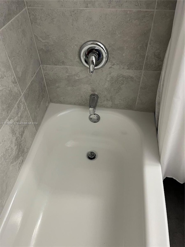 bathroom with tile flooring, a shower with shower door, toilet, and vanity