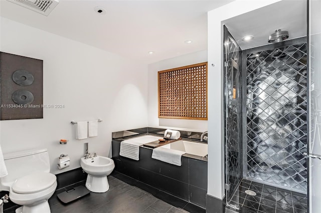 bathroom featuring a bidet, toilet, and a tile shower