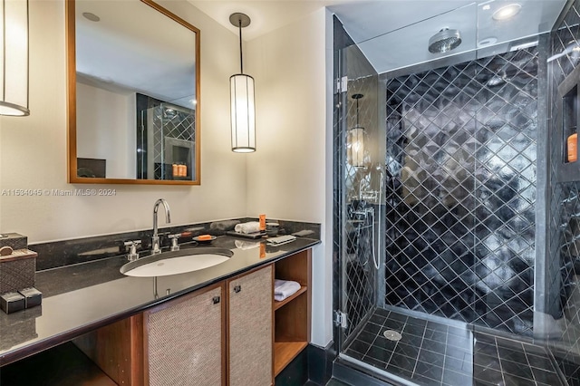 bathroom featuring an enclosed shower and vanity