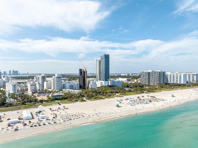 bird's eye view with a view of the beach and a water view