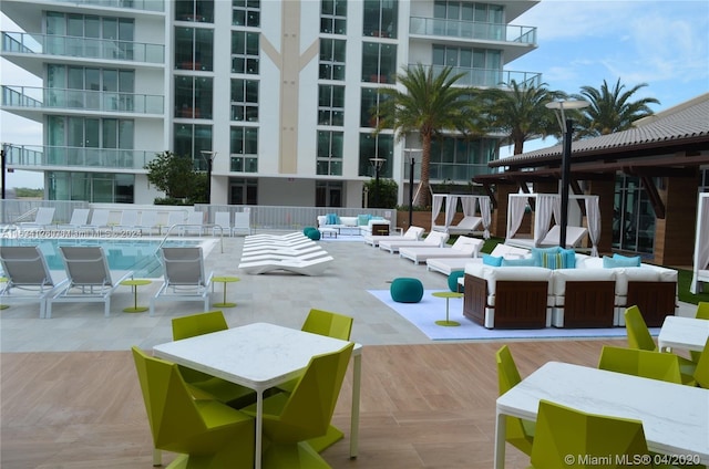 view of pool with a patio and an outdoor living space