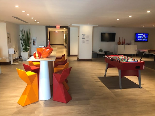 playroom with light hardwood / wood-style flooring