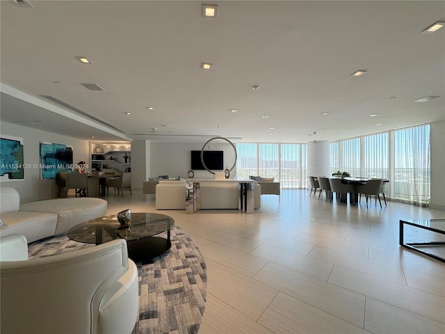 living room featuring a wall of windows