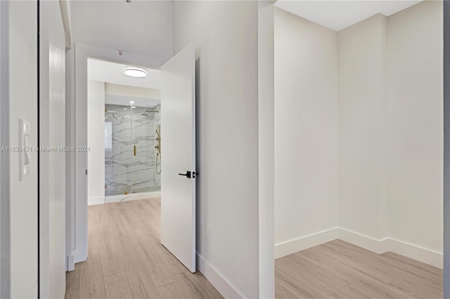 hallway with light wood-type flooring