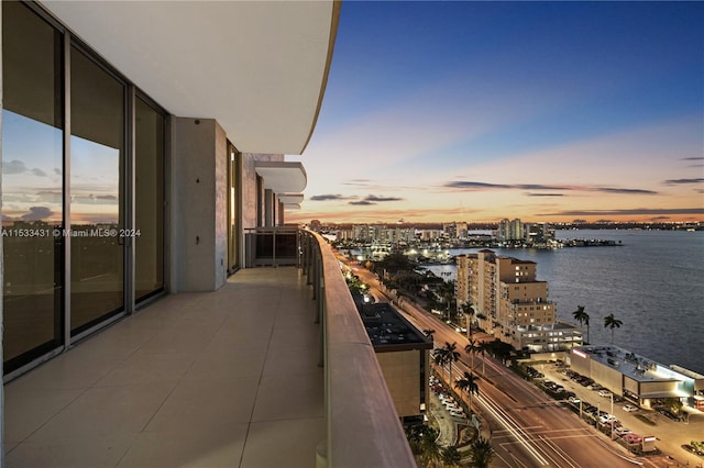 balcony at dusk with a water view