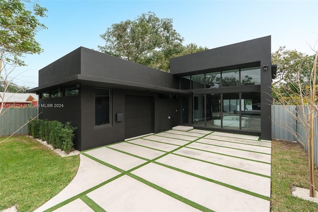 rear view of property featuring a patio