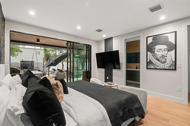 bedroom featuring access to outside and light wood-type flooring