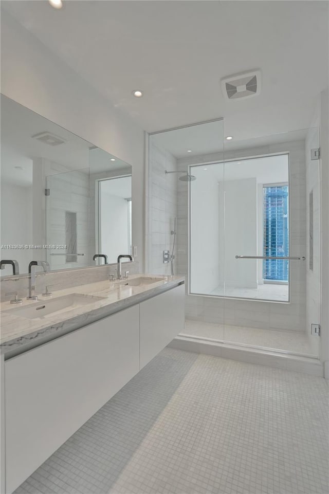 bathroom featuring double sink vanity and tile flooring